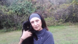 Marina Rosenfeld holding black cat
