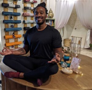 man meditating in yoga pose