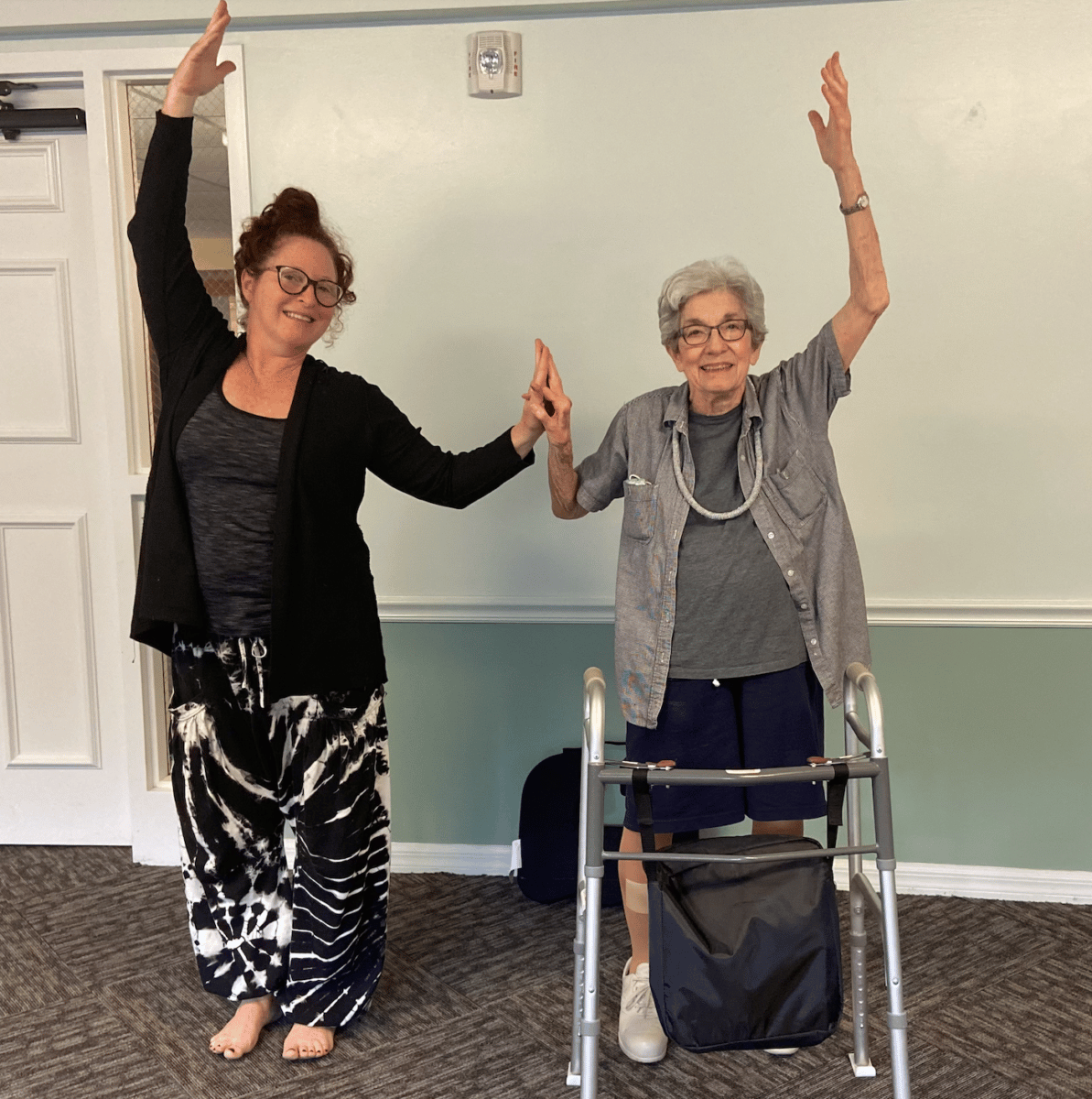 two women doing yoga for seniors